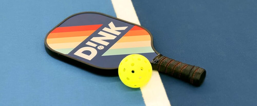 Dink paddle on pickleball court