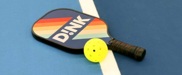 Dink paddle on pickleball court